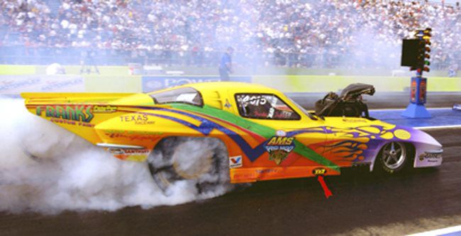 Funny car doing a burnout at the line